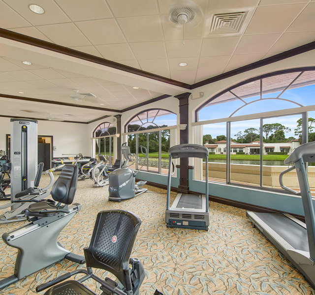 fitness room with various fitness machines in community