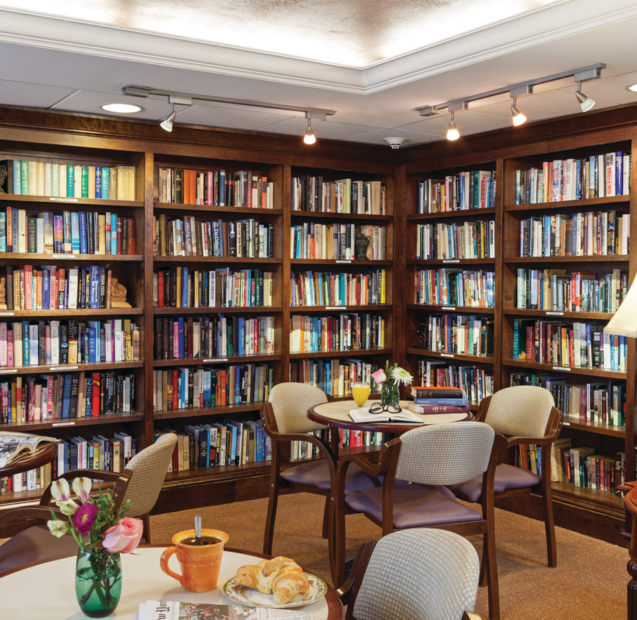 Library room filled with books and seating area.