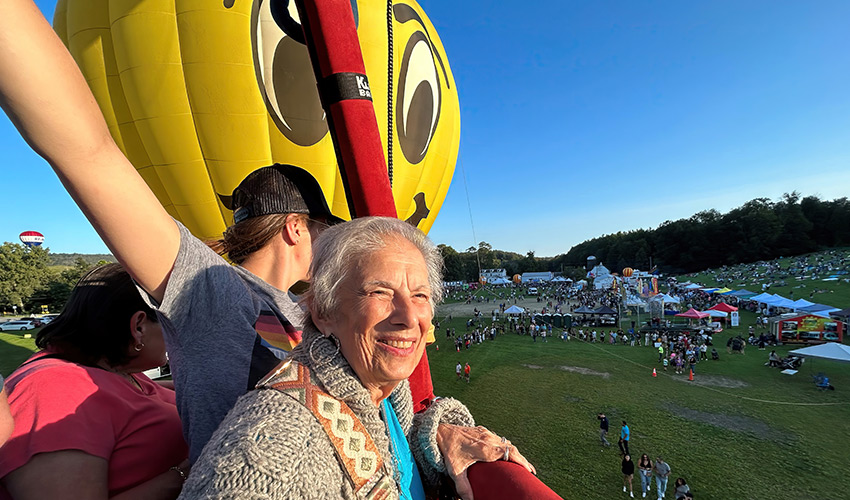 A person at a hot air balloon fastival.