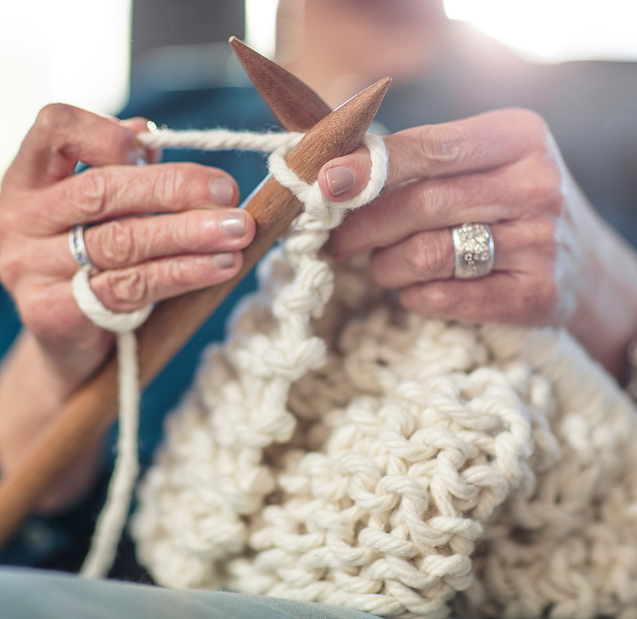 Person knitting.