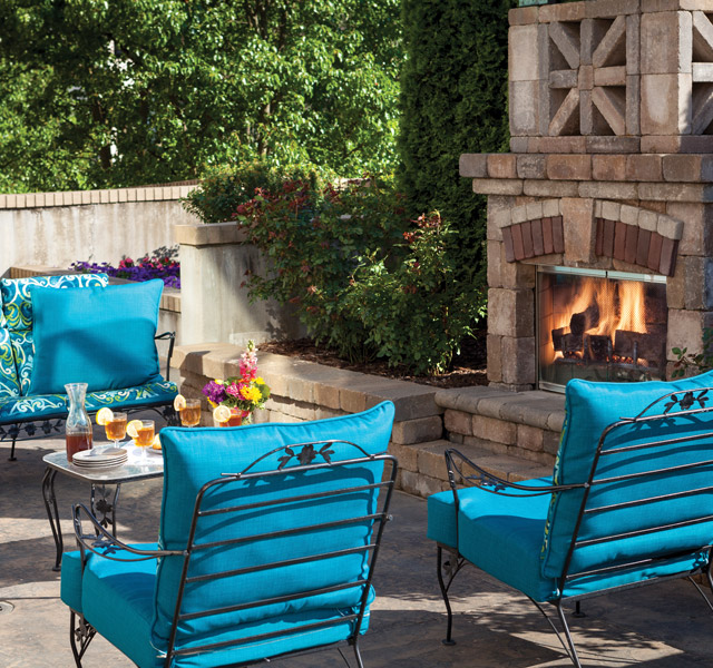 patio and chairs with fireplace
