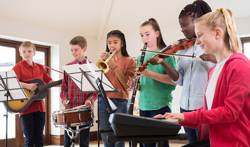 A group of kids playing instruments.