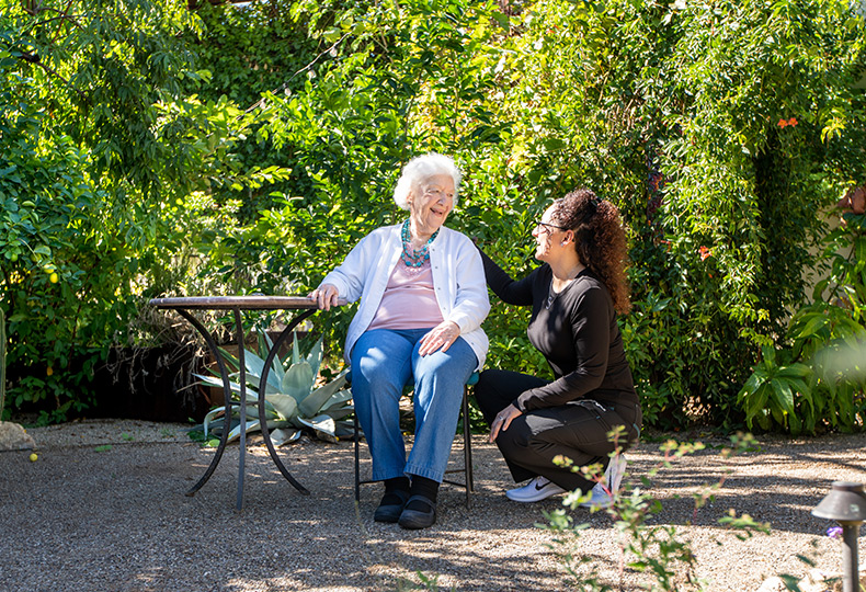 A resident with their caregiver.
