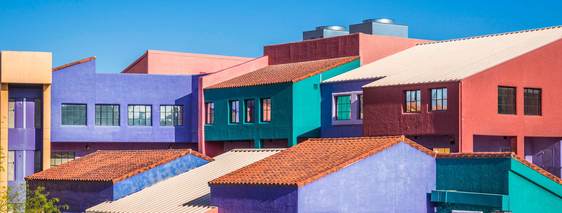 outside view of colorful buildings in a neighborhood