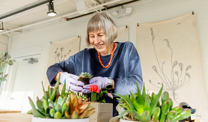 A person working in a green house.