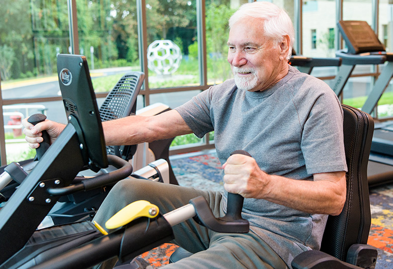 Resident using fitness equipment.