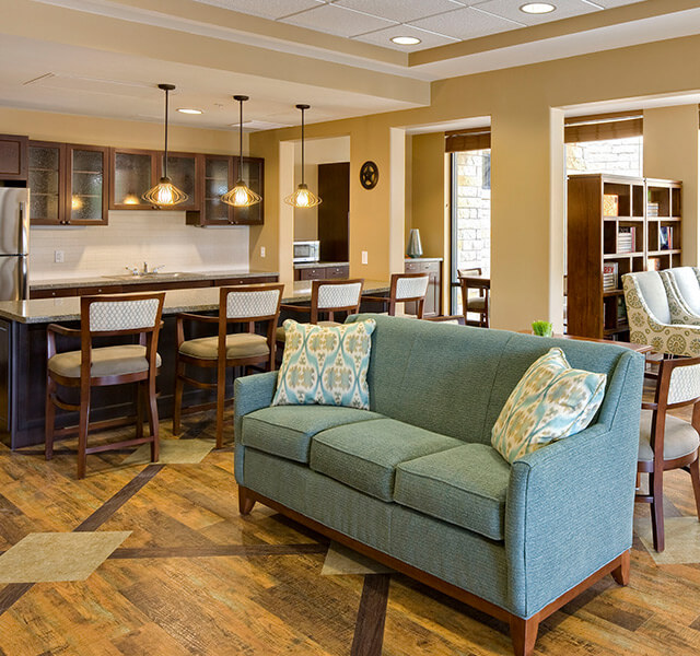 The Fountains at The Albemarle Assisted Living apartment living room.
