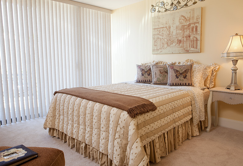 beige bedroom with a queen size bed