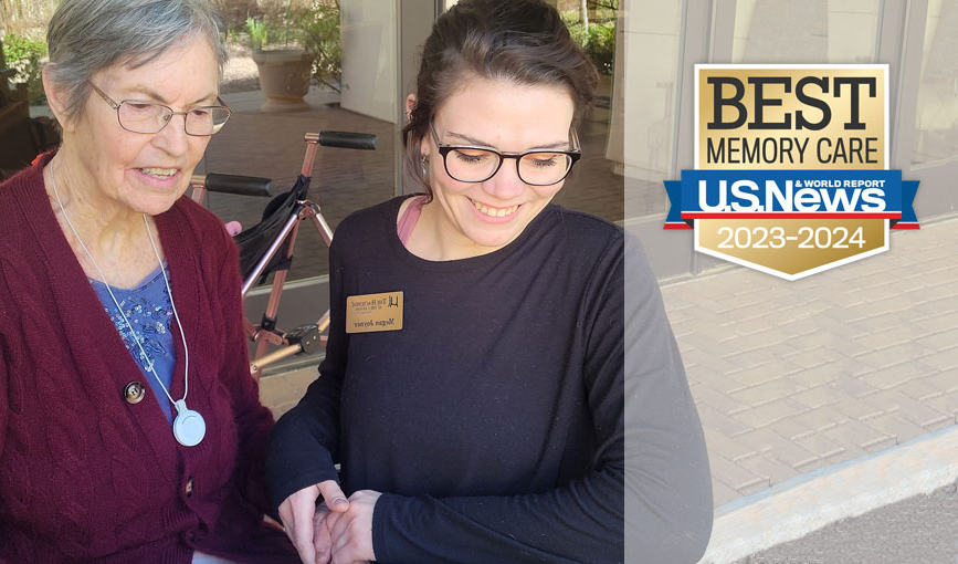 A caregiver helping a resident.