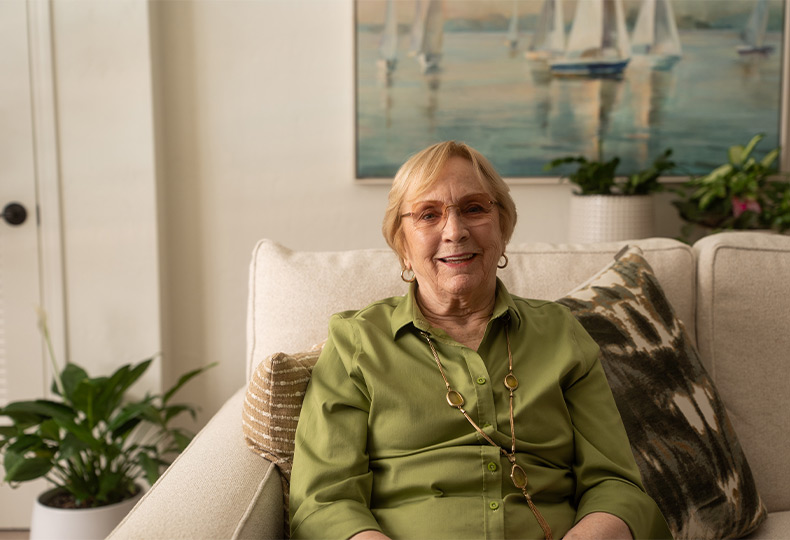 A person sitting on their couch.