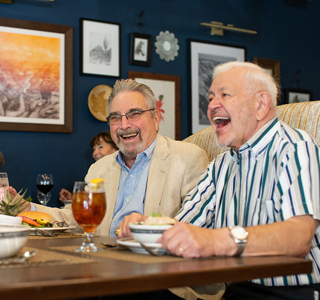 Residents laughing while out to lunch.