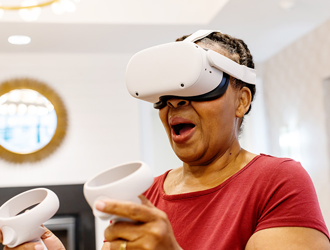 A person playing with a VR headset.