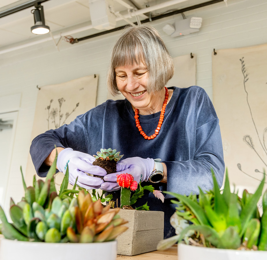 A resident happily gardening.