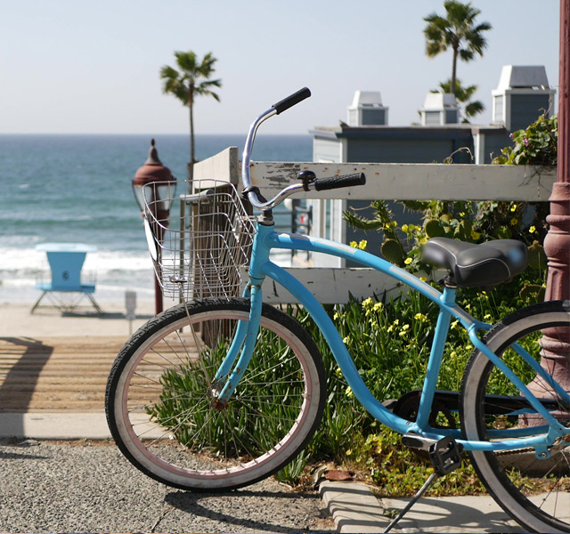 Bike parked by beach.