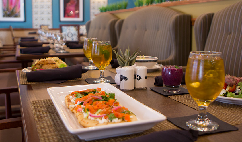 A table set with chef prepared dishes.