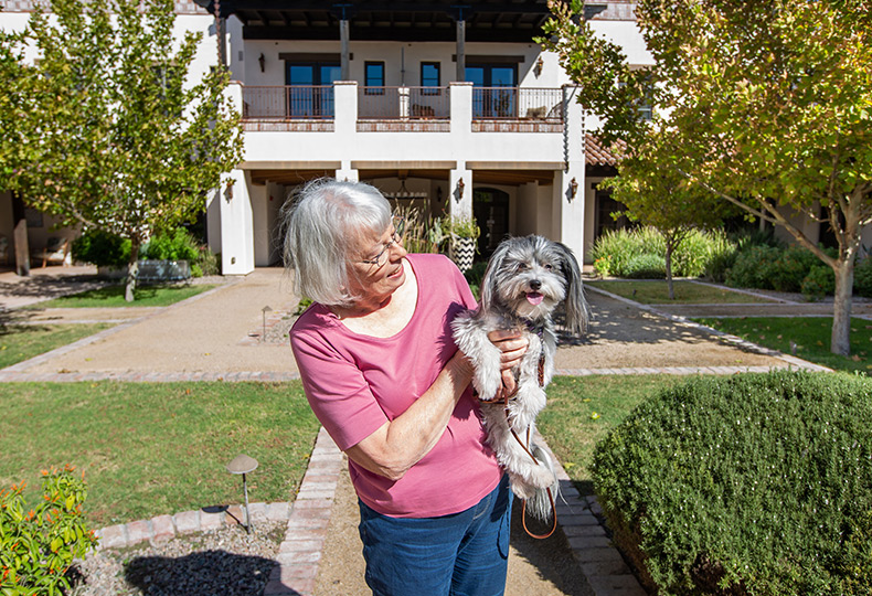 A resident sits with their dog.