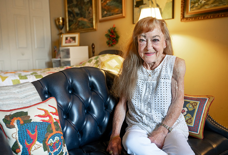 A resident happily sitting.
