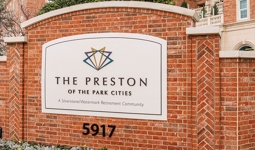 The exterior brick sign of The Preston.