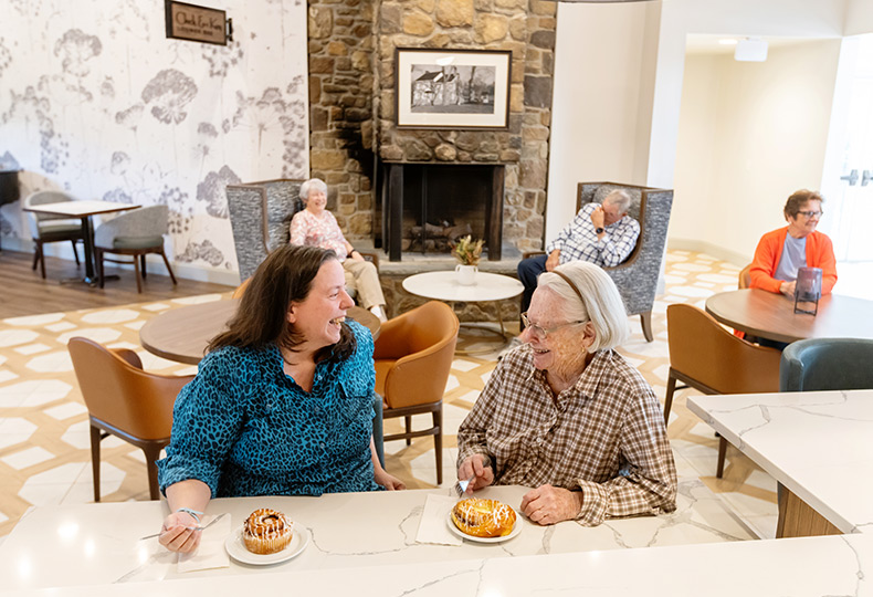 People having breakfast at a counter.