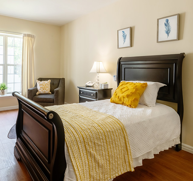 A fully furnished bright bedroom.