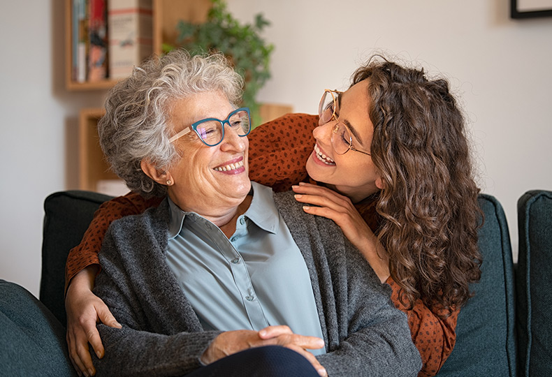 A resident a smiling at their family member.