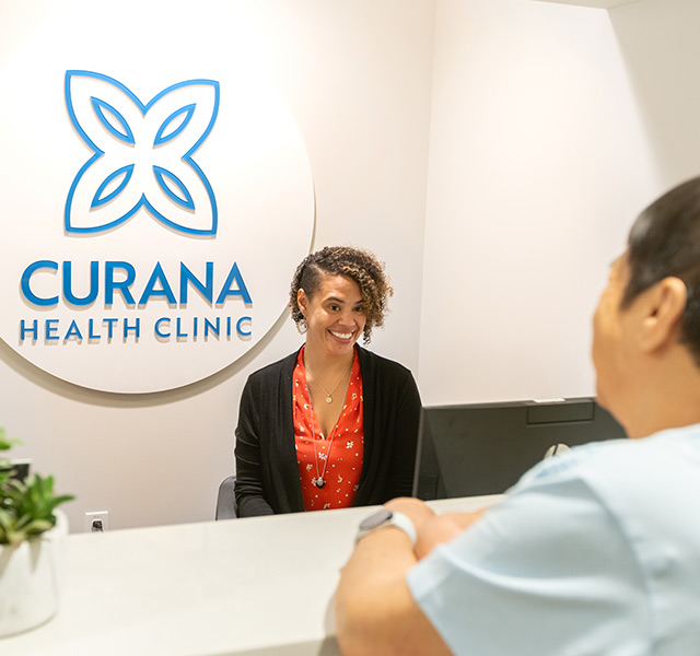 A person behind the desk at the clinic.