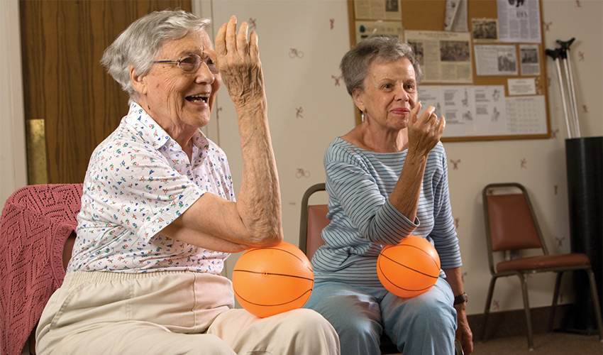 people exercising in chairs