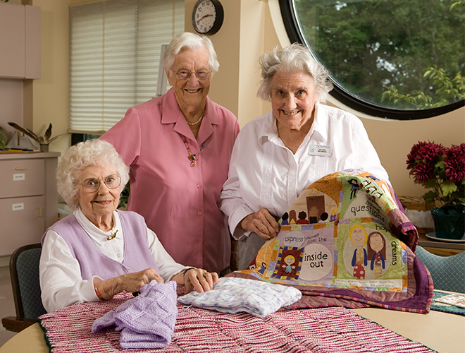 Three residents are knitting.
