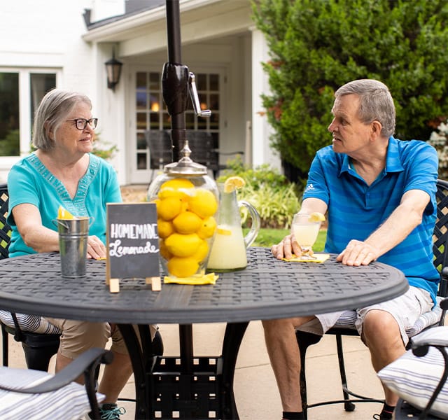 Residents are sitting on the patio.