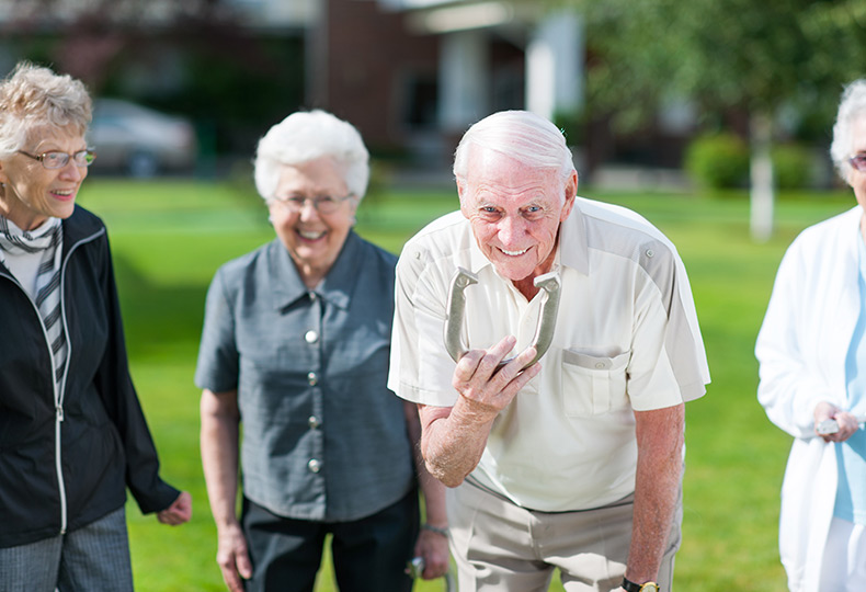 Residents are playing horseshoes.