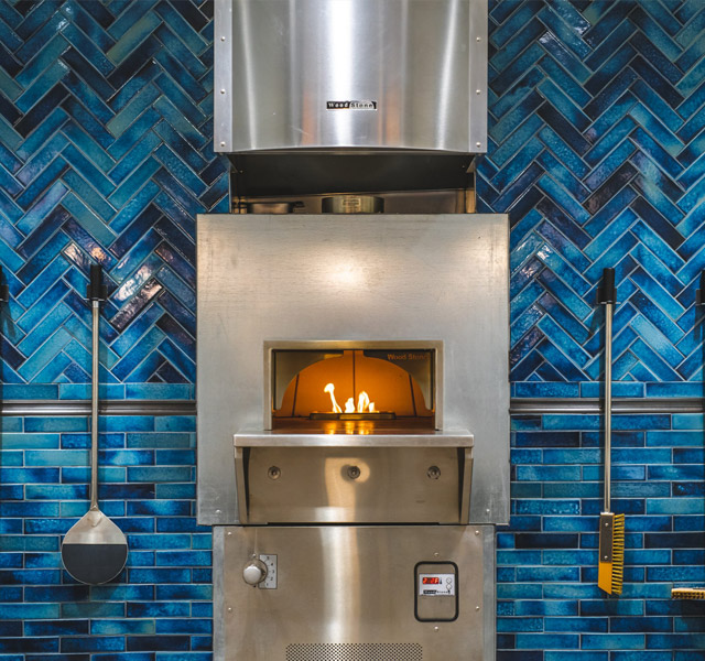 A wood fired over at the restaurant at The Watermark at Trinity.