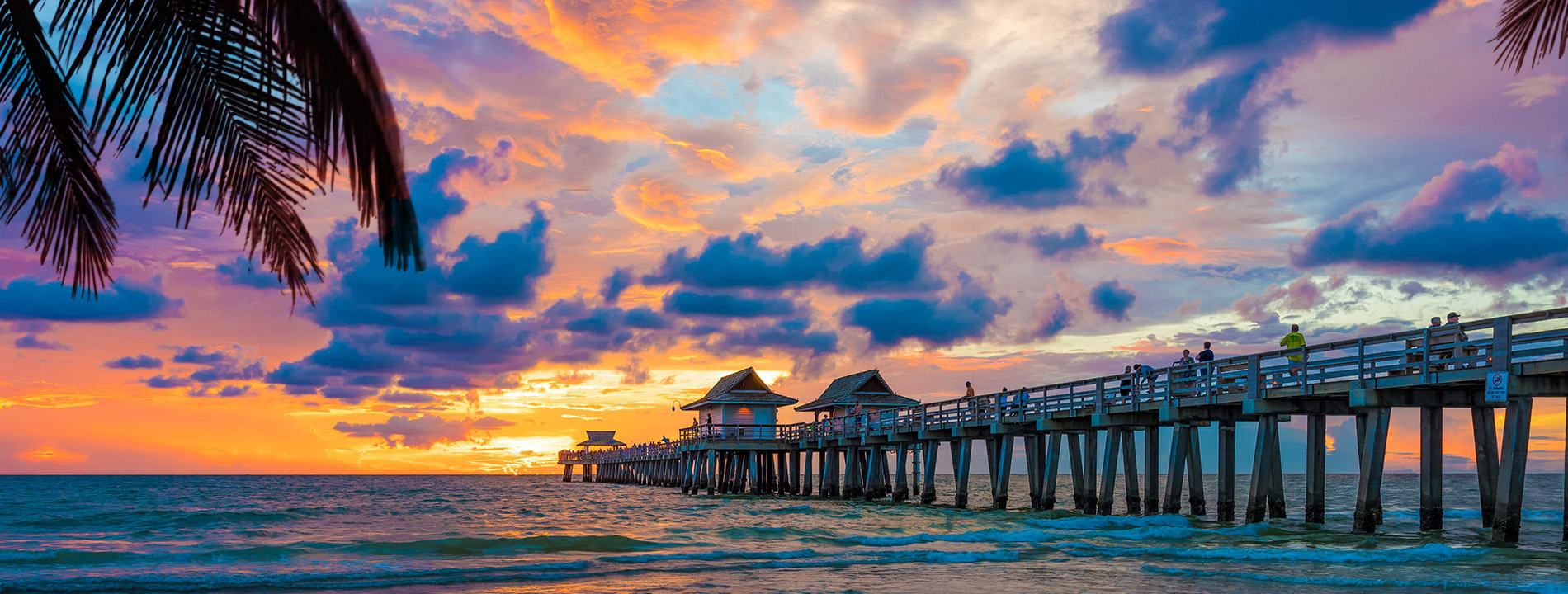 a boardwalk under the sunset.