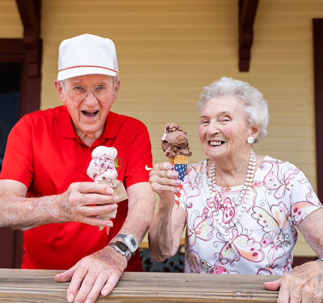 Residents are outside having ice cream.