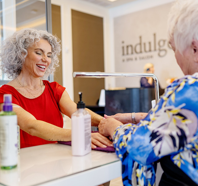 A person getting their nails done.