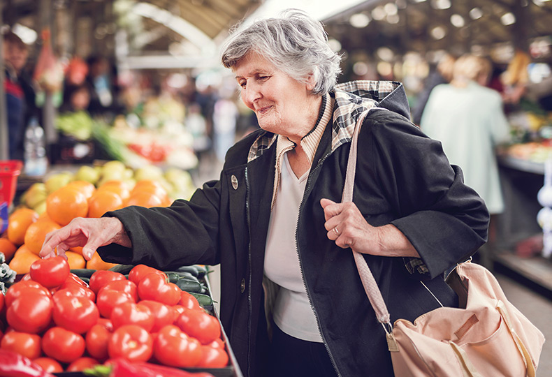 A person shopping at a farmers market.