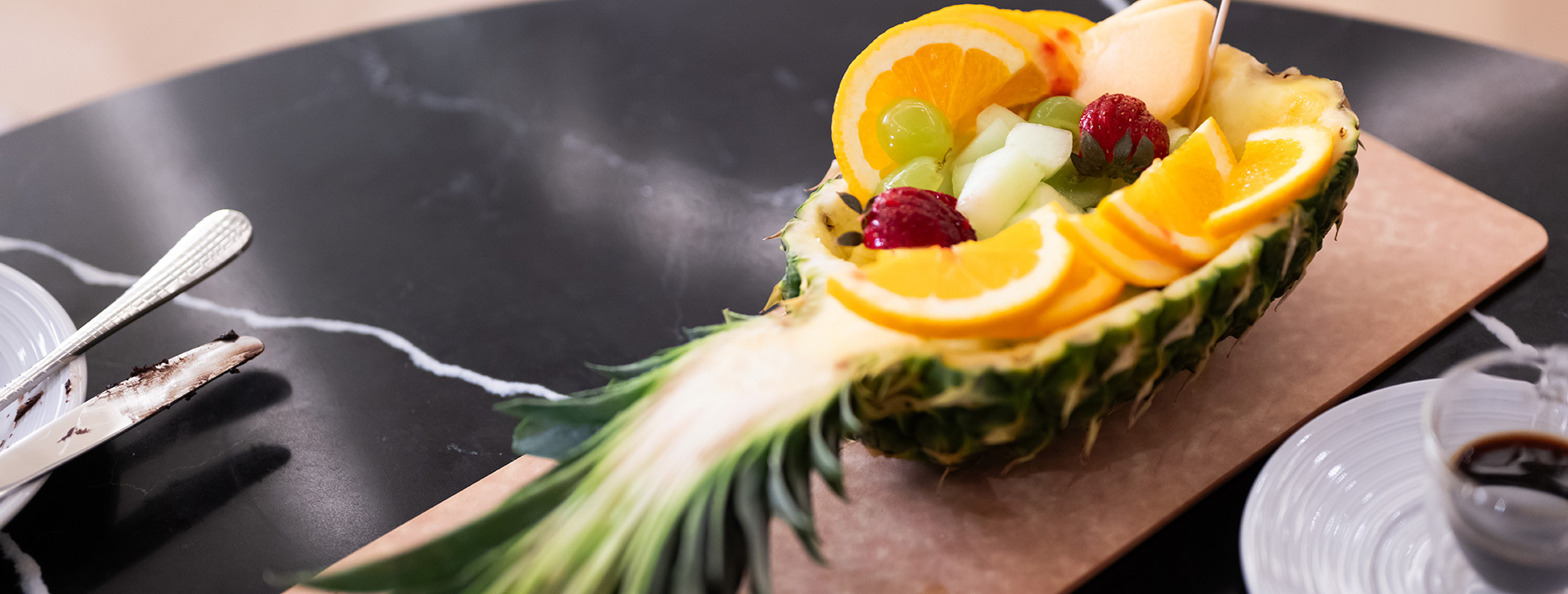 A pineapple on a table.