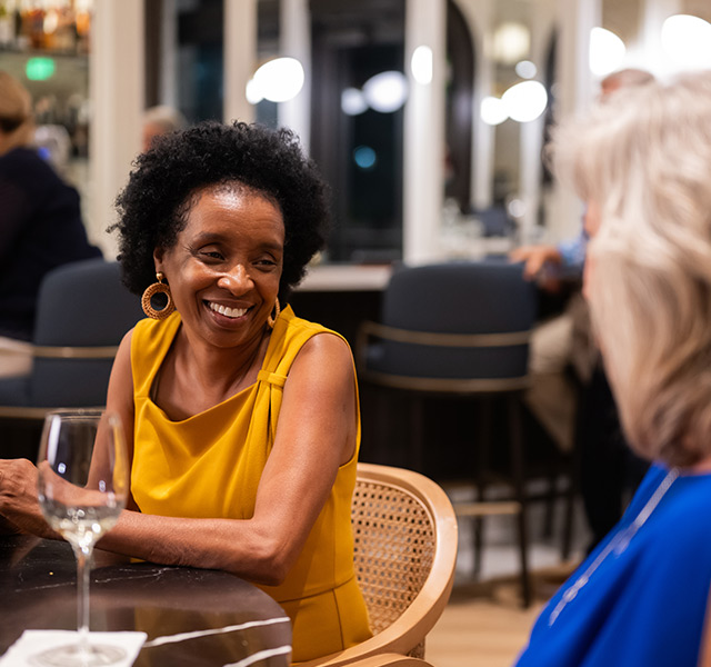 A person out to dinner with a friend.