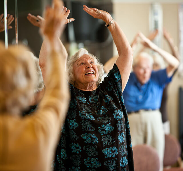 A resident is participating in a tai chi class.