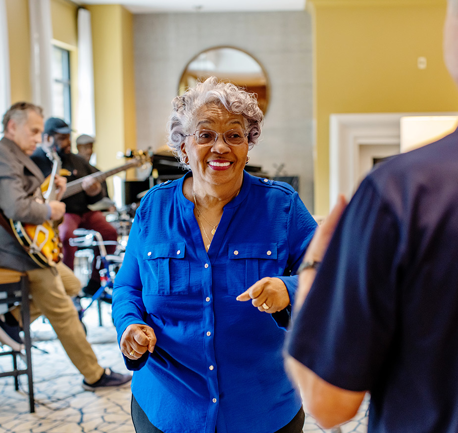 A resident dancing to live music.