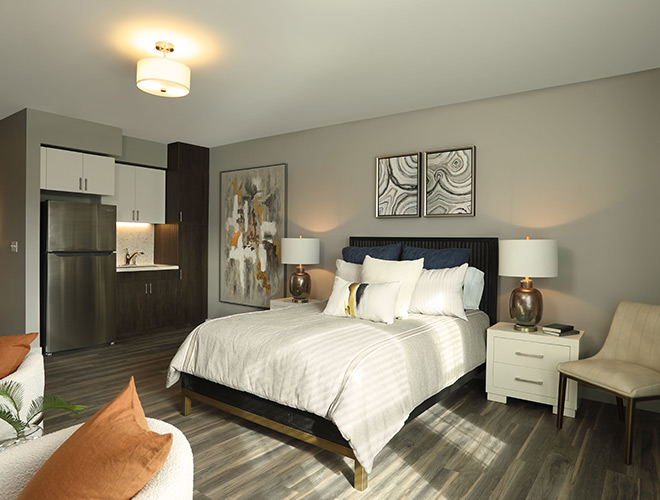 A fully furnished model apartment bedroom.