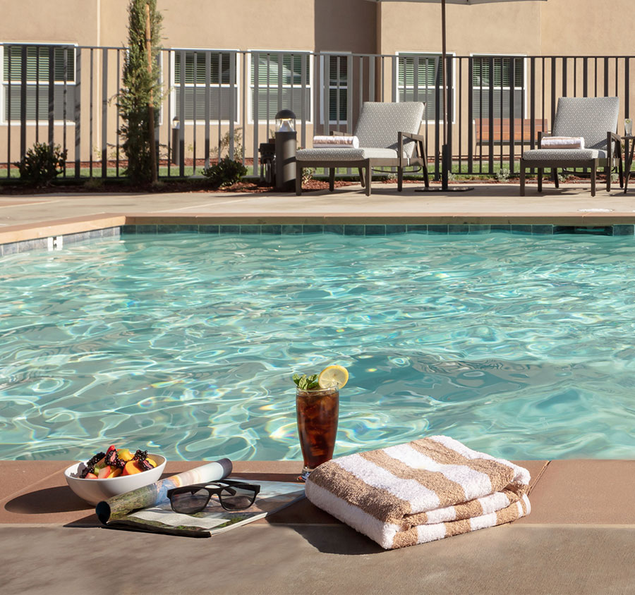 Fruit bowl and drink by the pool.