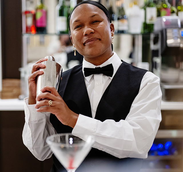 A person making drinks.