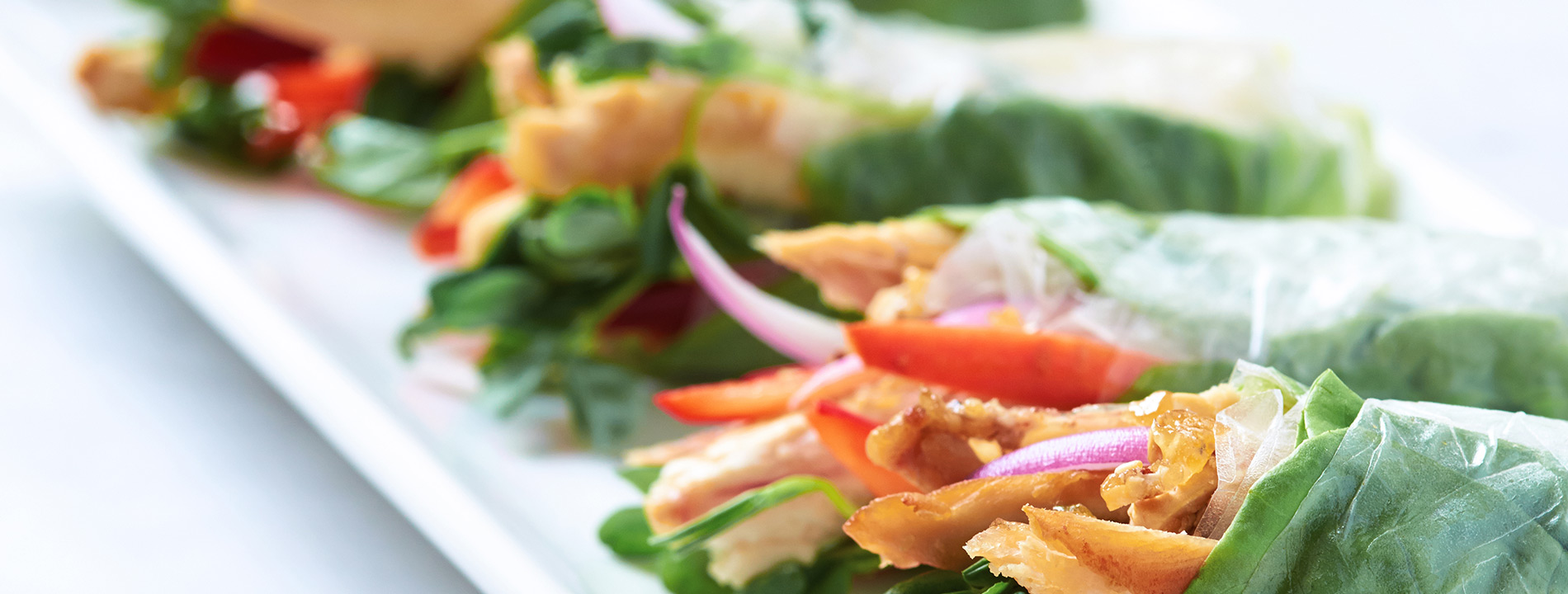 Lettuce wraps on a plate.
