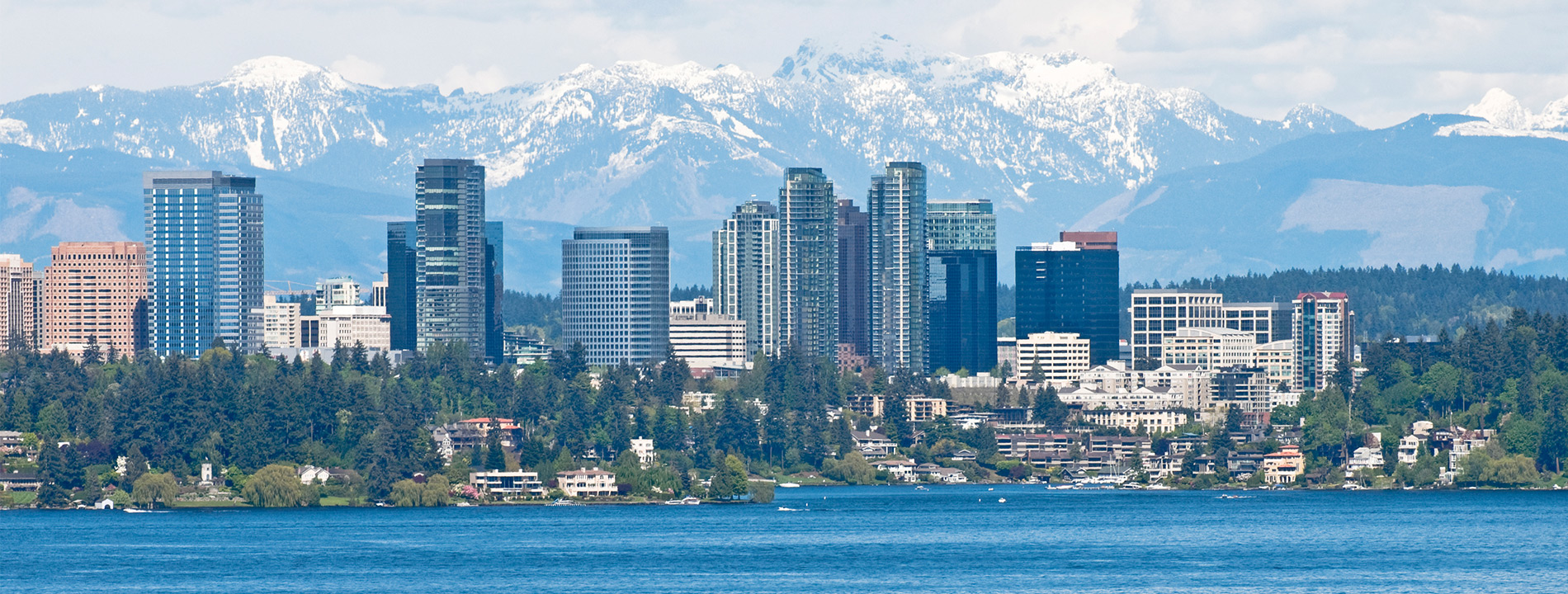 The city of Bellevue with mountains in the back.