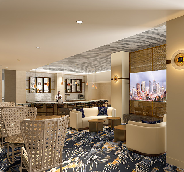 A lounge with seating and a bar.