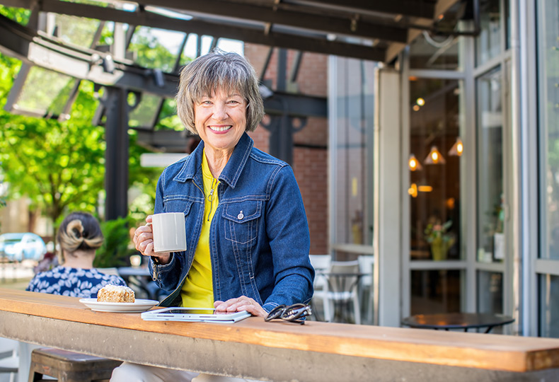 A person outside having coffee.