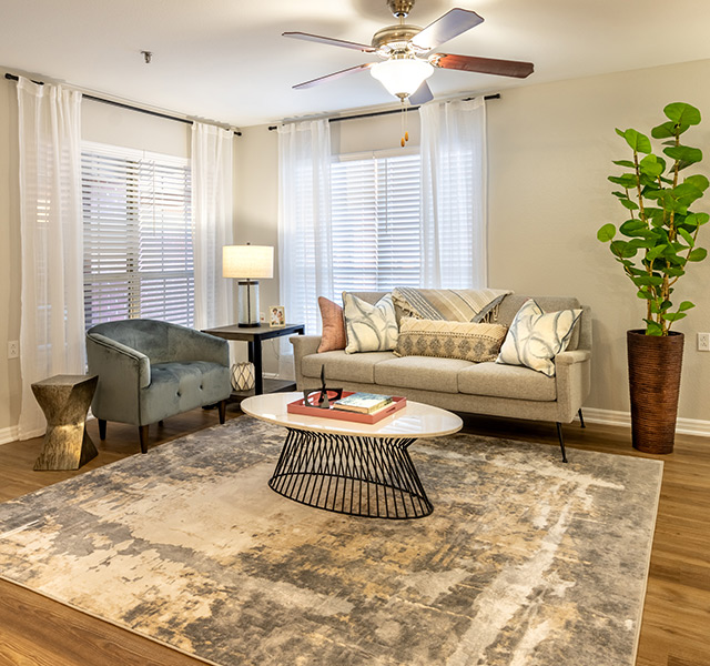 Living room setting with a couch and coffee table.
