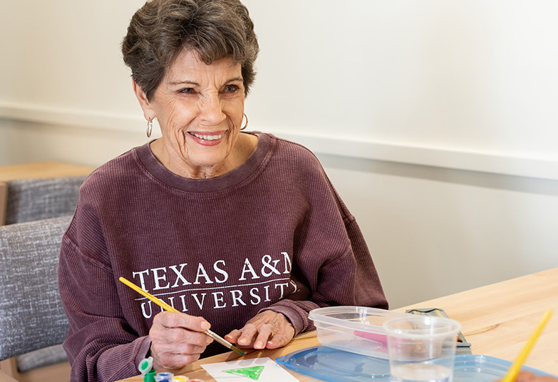 A resident in a painting class.