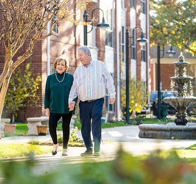 Couple walking in the courtyard.