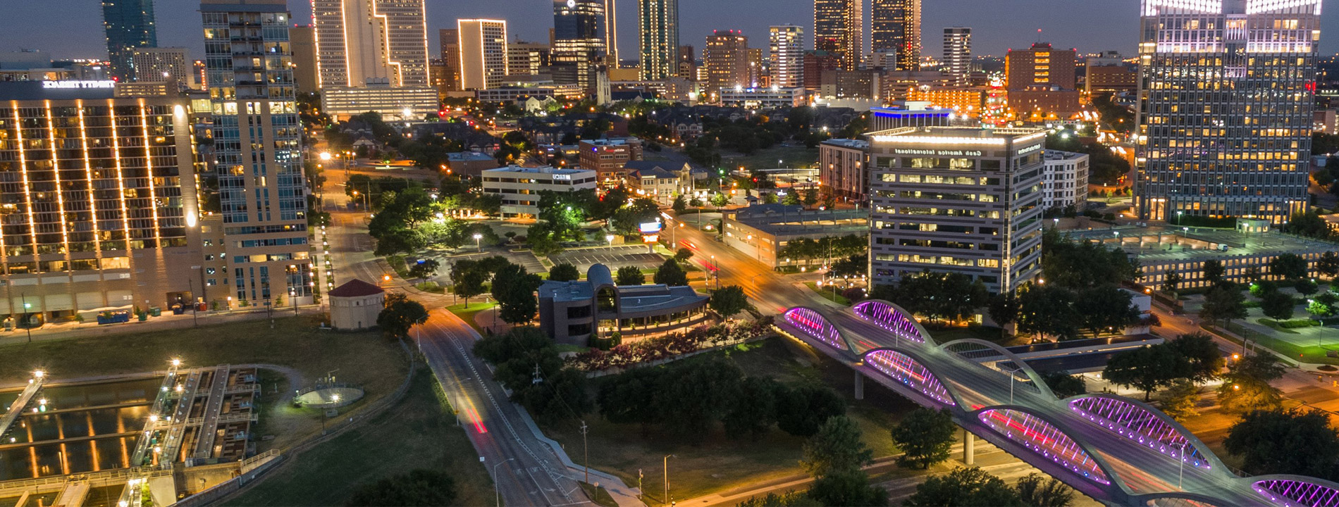 City skyline with city lights.